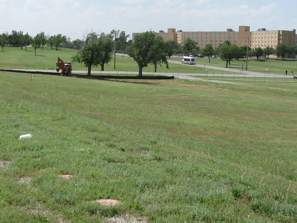 Honeycutt Road
In the background, Bldg 5676, Allin Hall, formerly the BOQ, opened in October, 1965.  The "twin tower", Bldg 5678, Aultman Hall, was opened shortly after.  Both BOQs are now "hotels".
Remember Honeycutt Road?  That's where you learned how to "lay the battery" with an M2 Aiming Circle.   This area will become a parking lot for a new elementary school to replace the very old Geronimo school.  I guess that's just "SADULU" for the old training site on the prominent ridge line of Honeycutt Road.
