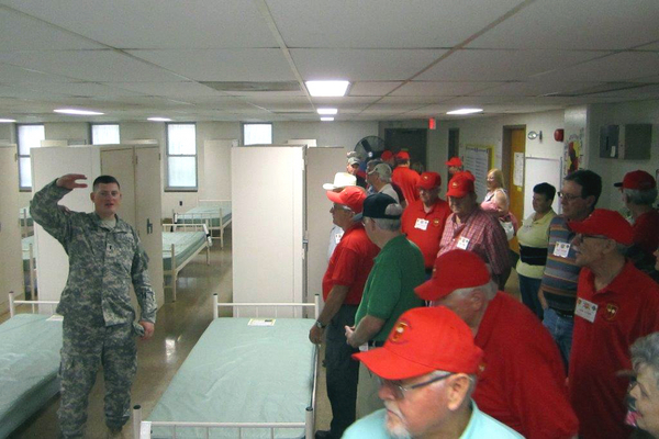 Reunion Photos - Danny Yates
Inside the training living quarters.  Our Guide indicates that all trainees must be at least this tall...or whatever he was pointing out.
