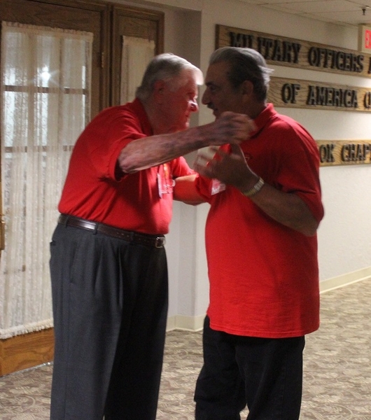 The Waldman Collection - Presenting Gifts
Host Jerry Orr and "Mighty Ninth" website creator Dennis Dauphin congratulate each other for the success of the historic reunion.
