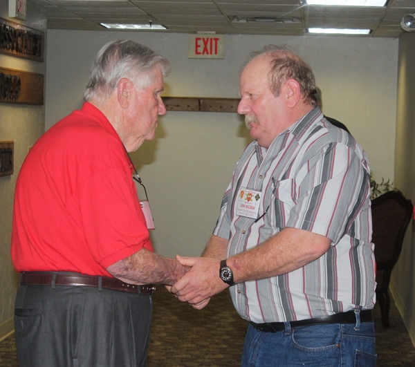 The Waldman Collection - Presenting Gifts
Host Jerry Orr presents a "challenge coin" to John Waldman.  John served both as the BnCo's driver and a cannoneer in A/2/9.
