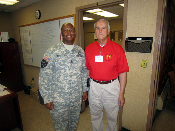 Reunion Photos - Wayne Crochet
The "old soldier" comes out in Wayne Crochet as it appears 1SG Doucette has called him to attention.   Well...at least that part of basic training Wayne can still handle.
