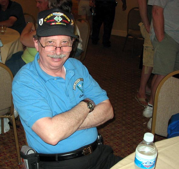 35th Inf Regt Webmaster & photographer Dave Muxo drinking water (?) at the Hospitality Suite.
