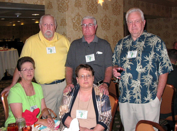 The Banquet
Lighten up, guys!  Veterans of A/2/35 during the 66-67 tour are Hal Bowling, Bobby Day and David Dunn.
Lovely wives join them at the dinner table.
