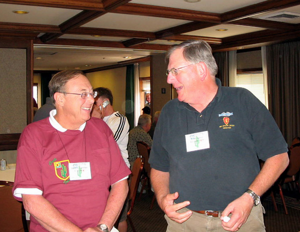 The Hospitality Suite
Bert Landau and Tom Jones, 1/14th & 25th Inf Div rep get the party started in the hospitality suite.
