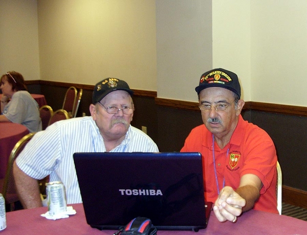 Hospitality Suite
Photo courtesy of John Waldman.
A great reunion!  Sgt John Waldman, left, served in the A/2/9 FDC with Lt Dennis Dauphin...some 40 years ago.
