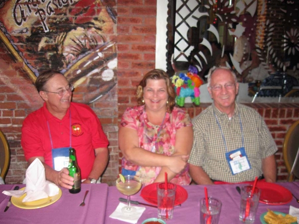 Party Time!  C-1-35 & 2/9th Arty at the LaMargarita
Lt Bert "Bert-Ku" Landau sharing smiles with Sgt Edwin Moor and guest Lou Ann.
