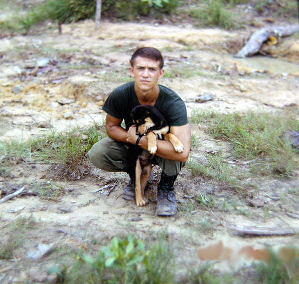 Our Buddy "Short Round"
Sp4 Joe Cook holds "B" Battery mascot, "Short Round".
