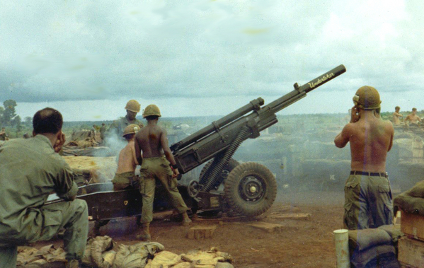 "The Undertaker"
The tube is named the "Undertaker".  Everyone wanting to file a VA tinnitus claim: Take Note!  See the safety ear plugs being used by the Cannoneer at right front?  I don't either!  The crew is firing the newer M102 Howitzer.
