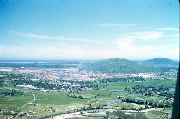 3rd Brigade, 25th -LZ Montezuma, FSB Bronco
Probably the best all-inclusive aerial shot.  Shows the airstrip, the easily spotted hill next to the base, and the blue South China Sea over the hill.  The US Marines originally occupied Duc Pho and were re-assigned further north toward the DMZ.  The 2/9th got the assignment in the Spring of 1967 to replace them.  The 3rd Bde Commander re-named the base "FSB Bronco", replacing the Marine's choice.  Troops were warned not to climb the hills due to booby traps and mines.
