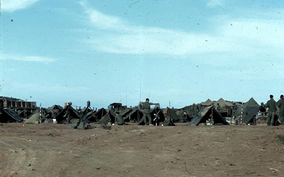 Encampment
You know you're with the "grunts" when you call a tent "home".   And when a helicopter lands, you get to chase everything all over the landscape.
