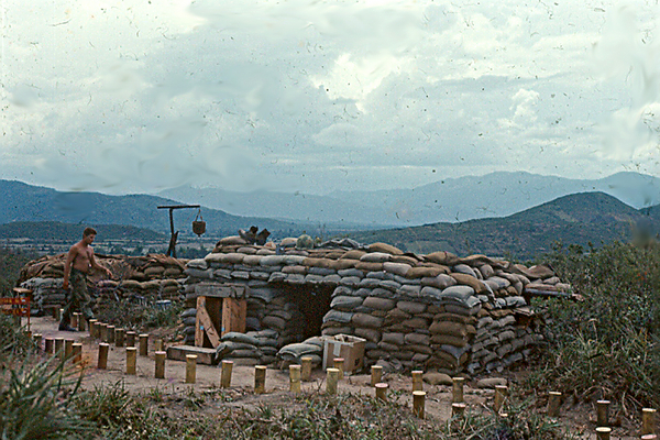 Artillery Dignity
LZ: OD.  An Artillery firebase is not complete without a shower and cannisters to mark the pathways.
