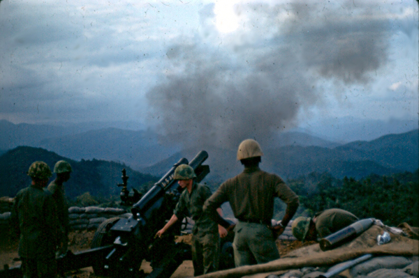 "On The Way"
Well, it was.  Then it became "Shot, Over".  Camera captures the 105mm howitzer in perfect recoil.
