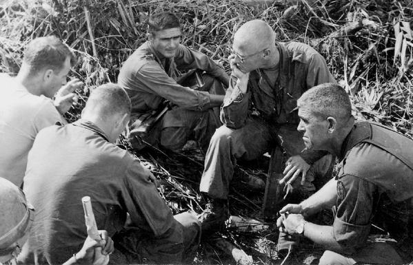 Fighting at Dragon Crater
Debriefing Session on 14Nov66 after the battle of Dragon Crater.
L to R: Platoon Sgt Hatch; UNK; Lt Marve McGraw; Lt Dennis Munden; Major Erhard.
