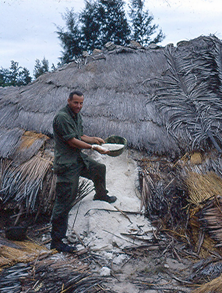 Lt Keith holds a helmet-full of salt.
