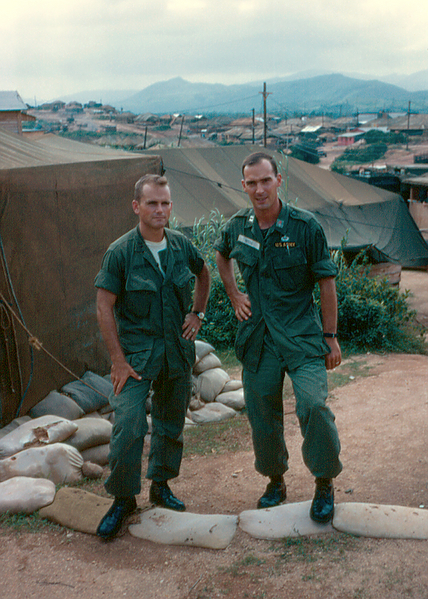 Battle Ready
Capt Doug Johnson and a Signal Corps officer (UNK) test out the sandbags.
