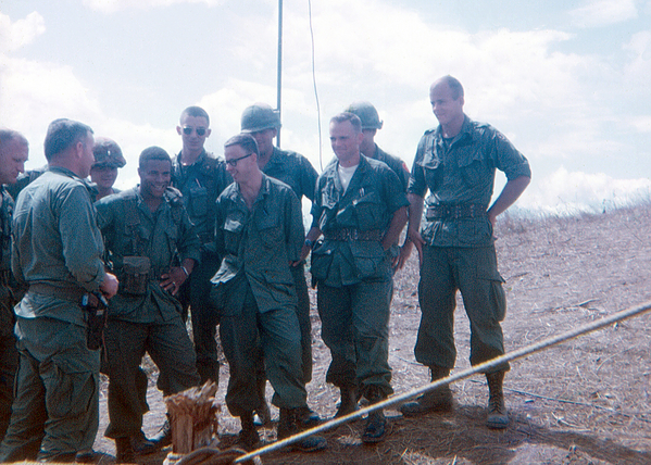 "Just wanted to let you guys know that we are going to throw a little party for Ho Chi Minh tonight".  Informal staff meeting in progress.  (L to R) Maj Gerrold Tippen, S-3 for 1/35; LTC Bob Kingston (BnCO, 1/35, later becoming a general), (Unknown), CPT Bil Baker, S-4, 1/35) (Unknown), Maj Doug Johnson, Doctor from the 1/35 Inf, Lt Cal Graef, 4.2 Mortar Plt Leader.)
