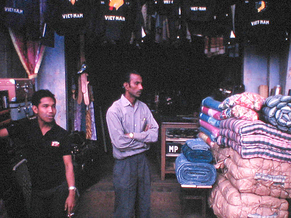 Sights & Scenes
Vietnamese Clothing store.  Just like American stores, they have salesmen waiting.
