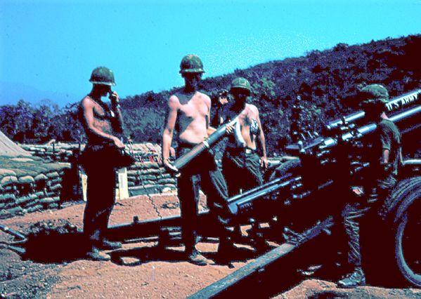 Executive Practice
Btry CO Lt Springer gets "down & dirty" practicing the craft of the cannoneers as he prepares to load a projo.  He and the XO made it a point to learn and remember just how important each crew member's job was.
