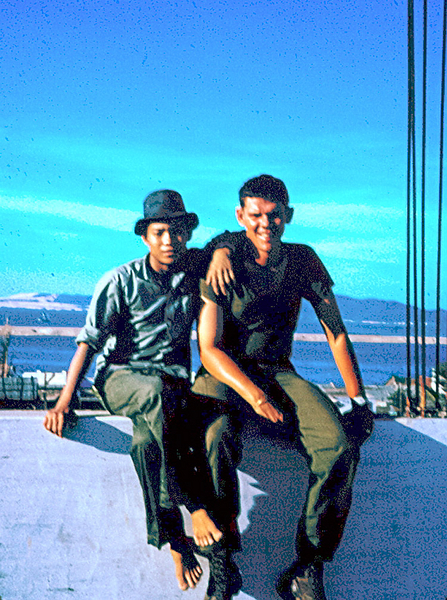 Qui Nhon
Houseboy sits with Lt Springer atop a hotel in Qui Nhon.
