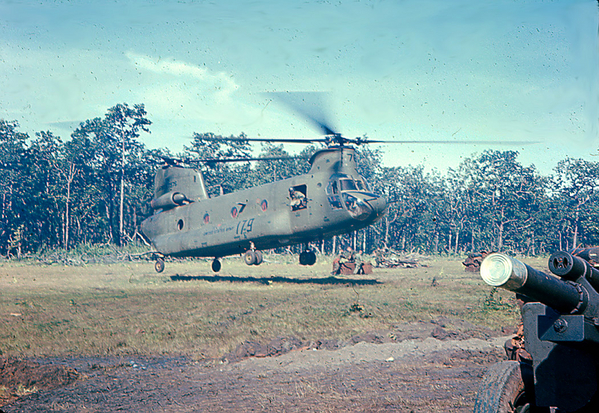 Big Bird
The Chinook pilots had to bring the bird down to ground level.  Note one of the pilots checking out the rear of the aircraft.
