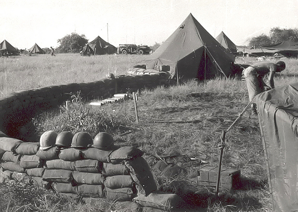 Gun position
Cannoneers preparing howitzer position in order to have 6400 mil (360-degree) firing capability.
