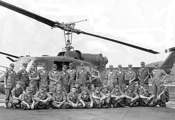 All the guys in 2nd row were from DivArty units except for the last 2 guys.L-R  Emory Saylor (B Btry 2/9), Harold Woody (Hq&Svc Btry 2/9). This is just the armed plat photo, the others Sgt Robert Gibson B Btry, Sgt Elbert Bacon A Btry were on the slicks and I don't have a photo of that platoon.  Photo taken while we were TDY on Shotgun 10. Date 28 May 65 at Vung Tau, RVN. The unit we were attached to was A/82 Avn Bn.

