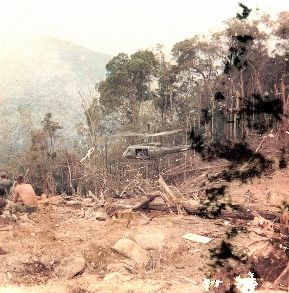 Incoming Chopper
An excellent photo and "memory of being in the field" in Vietnam.  This picture shows the talent of our Huey pilots getting into and out of hastily created LZs.  You can almost hear the "pop-pop" of the blades.
