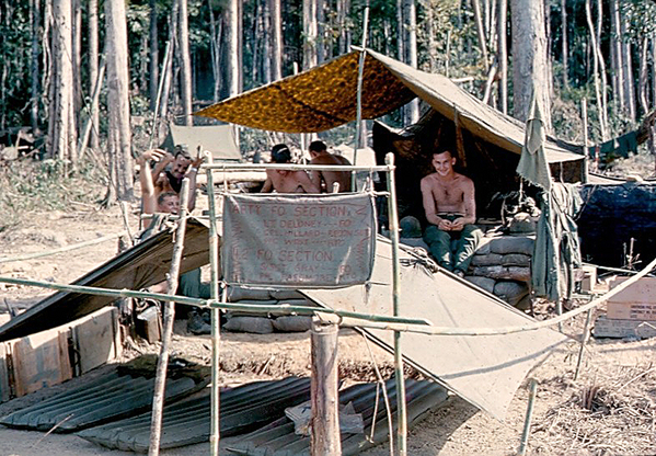 Luxury accomodations
The FOs have posted a sign next to their "bed & breakfast" with luxurious air mattresses.  The sign reads: ARTY FO SECTION, then "FO PARTY, LT DELONEY, FO; CPL MILLARD, RECON SGT, PFC WEST, RTO.  Below that, it lists the four-deuce section with "S/SGT GRAY, FO; PFC PASSMORE, RTO".  Hours are 24/7.
