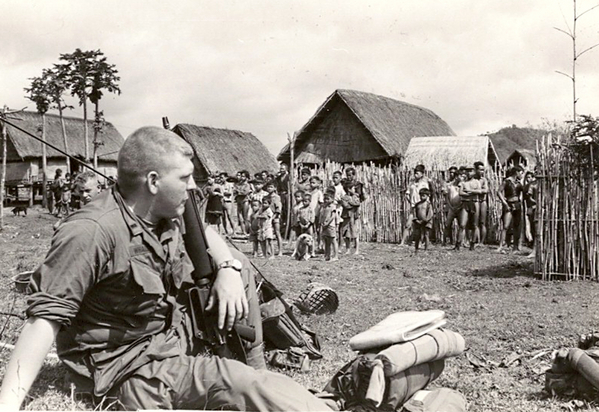 Lt Dave Whaley, FO
Lt Whaley observes action in a village.
