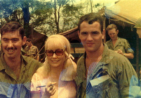 Can I keep her?
Jim "Tex" Shelton and Mike Medley surround Chris Noel, model, singer and actress who visited their LZ.  Ms Noel was honored with an award for her support visits in Vietnam.
