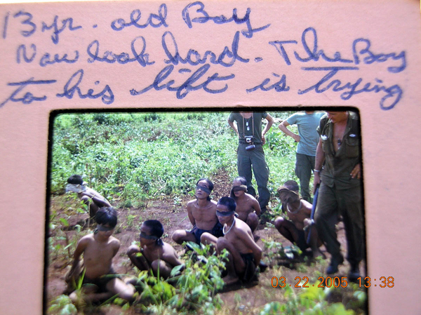 Captured rice carriers
Joe notes that the 13-yr-old boy in the left is trying to loosen his bonds.
