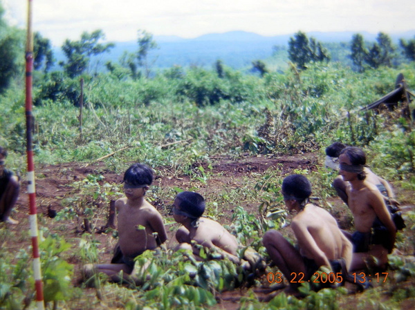 Captured rice carriers
Young boys captured as rice carriers for the VC.  One is whispering to the other as I heard them.  See "Tour of Duty - Memories" for the whole story.
