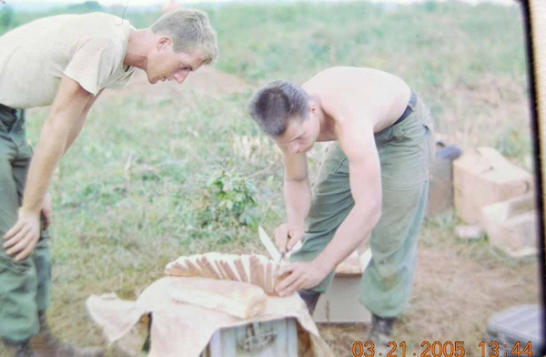 I wasn't doing a good job, so the Medic took over.  Note the surgical precision he uses to cut the bread.  Medic Riddle was the same guy who attended to SSG David Spears who was KIA during a firing incident.
