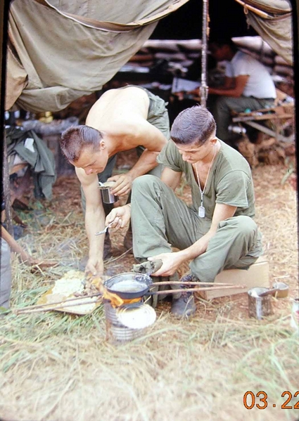 More Cooking Lessons
Medic Riddle now teaches the BC, Capt Jack Osborne, about cooking in the field.
