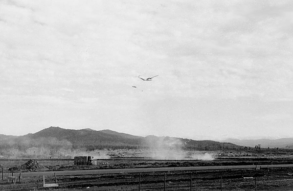 Supply drop
Parachute can be seen just under the aircraft.
