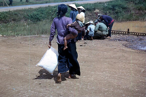 Vietnamese mom
Looks like she could use some Pampers.  Do we have a dice game going on in the background?
