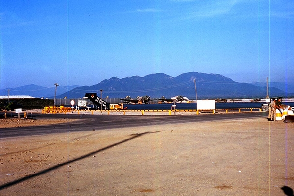 A WELCOME sight, fer shure
Cam Ranh Bay...in all of its glory.  Note the aircraft boarding stairs with the inscription "Cam Ranh Bay" and the soldiers wearing khaki uniforms.  We made it out of the jungle.  Next stop: US
