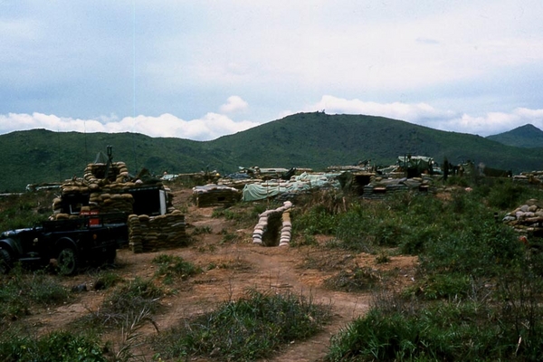 LZ OD
Location looks like LZ OD.  Extensive use of sandbags and interlocking, sandbag-covered trenches.  Also, the CONEX FDC has a BC scope on top.
