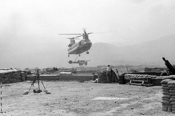 Taking a new position
Setting up a new firebase.  Note the M2 Aiming Circle and the red-white striped aiming stakes in the photo.
