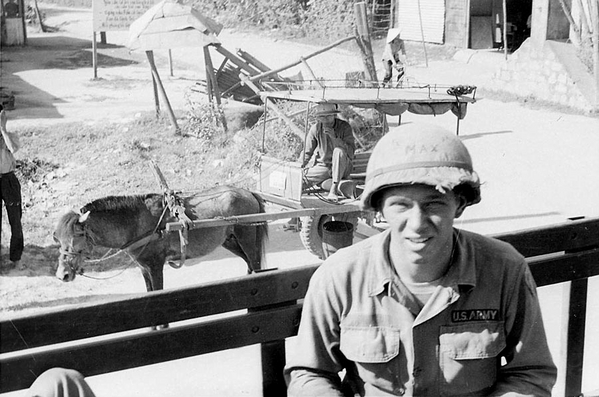 Convoy
UNK soldier.  Passing the locals in a convoy.
