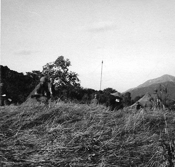 Guard Duty
Standing guard over a VC prisoner.  LZ Tip, Feb 67.
