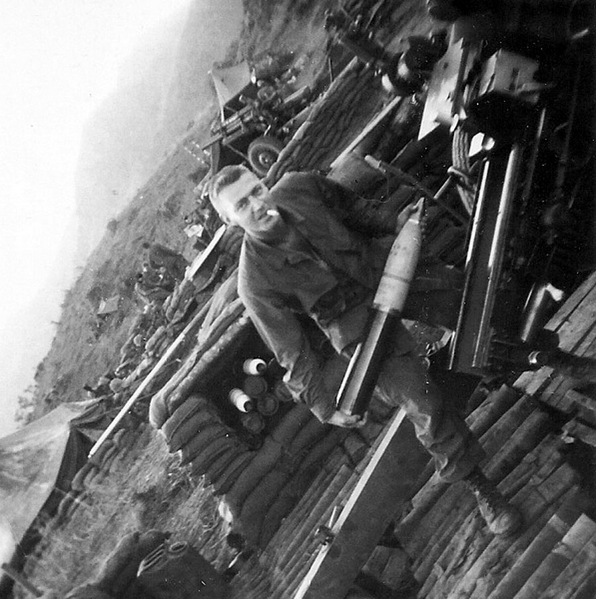 No time for a smoke break
PFC James G. Hourigan loads a "big bullet" into the 105mm howitzer.
