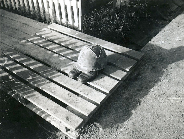 "Short-Timer"
What does a "short-timer" look like?  Well, here is your big clue.  The steel pot was damaged by a mortar round.  The white picket fence led to the Marines tent area.  One of the Marines saved my neck when we were overrun by the VC with satchel charges in our commo area.
