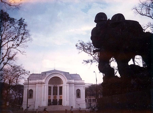 A beautiful building on the square in downtown Saigon. Originally a French opera house and also the seat of the South Vietnamese legislature (best info).  Also, note in the right foreground the huge bronze sculpture that was a memorial to South Vietnamese soldiers.  To the right of this shot was the  beautiful French Caravelle Hotel.
