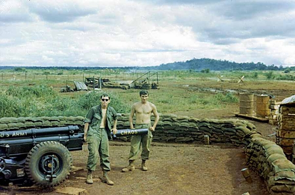 "Chaos"
Sounds about right to me! We excelled at chaos.

Mark Gannon and Rick posed with the new cannon.  The Section was located next to an abandoned Special Forces airstrip.
