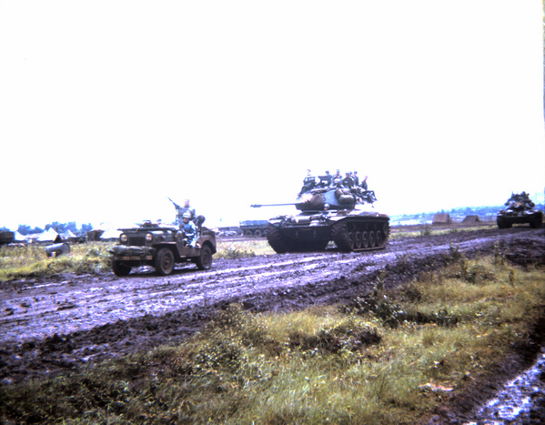 Muddy convoy
Jeep leads a tank on a muddy convoy.
