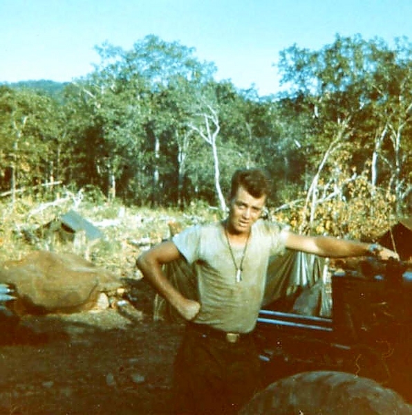 LZ 11 Alpha
Here I am and it's 1966.  Sp4 Michael Huseth pauses to pose at LZ 11 Alpha.  This photo was taken a day or so before a "muzzle burst" injuring 20+ in our battery.
 
Note the tree line which was lowered by the 65th Engr Bn.
