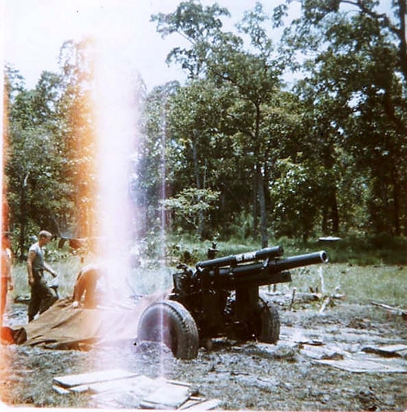 Muckety-muck
Saddle up and move out.  Our 105mm howitzer is knee-deep in mud as we prepare it for extraction.
