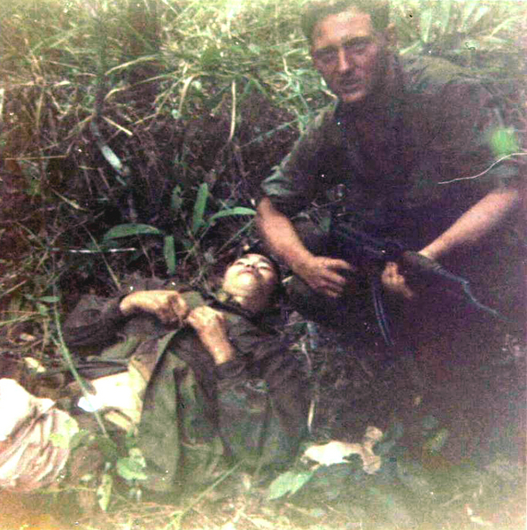 Doc & POW
Doc watching over NVA prisoner.
