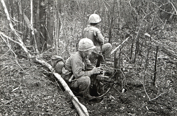 LZ Lane
An excellent photo...makes you feel like you are there with them.  Note the two ammo clips taped together and the smoke grenade on the web belt.  Yep...that's men in the field.
